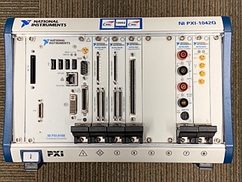 Photo of National Instruments PXI System with Two FPGAs, Image Acquisition Module, Digital Multimeter, and an Arbitrary Waveform Generator