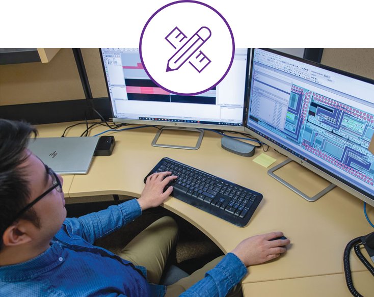 phtoto of man working at a desk with two monitors