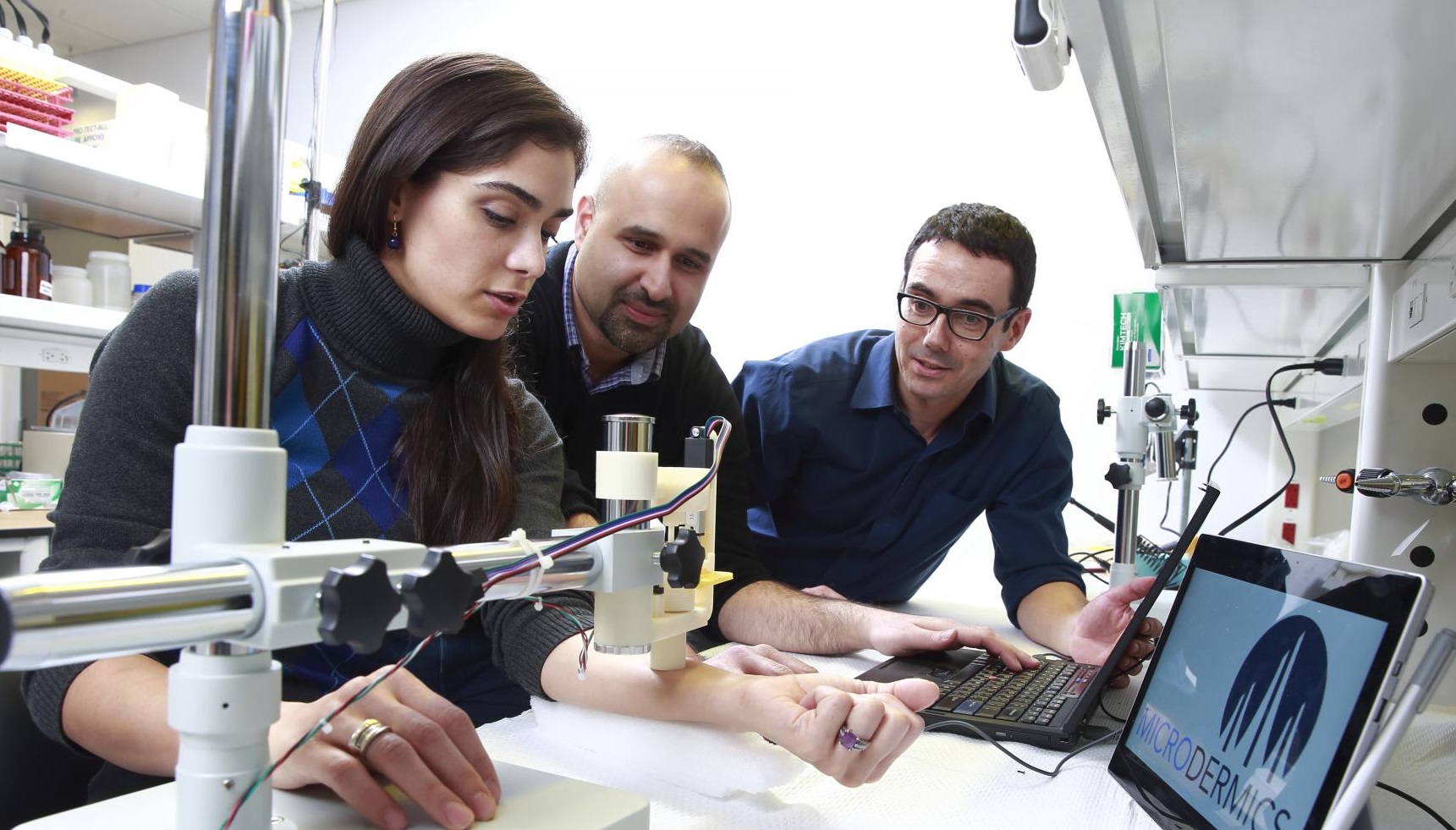 Dr. Boris Stoeber with company co-founder Iman Mansoor and Dr. Mehrsa Raeiszadeh, a Microdermics employee, demonstrating less invasive blood sampling.