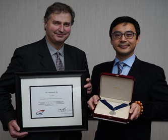 Mr. Gord Harling & Dr. Alphonsus Ng holding Colton certificate and medal