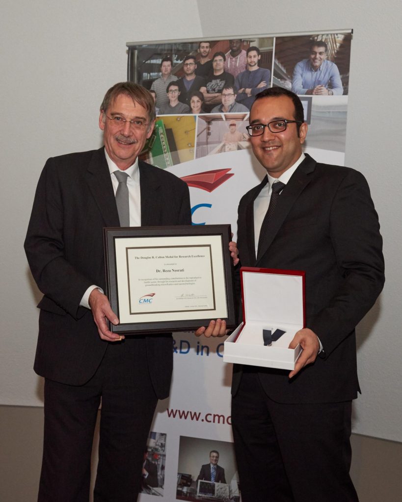 Dr. Reza Nosrati & Dr. Ian McWalter holding Colton certificate and medal