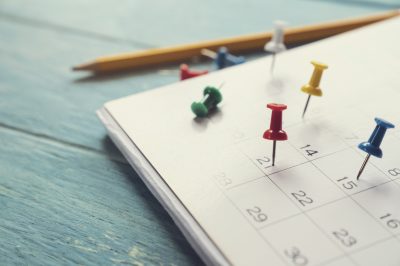 close up of calendar on the table, planning for business meeting or travel planning concept Link to Fab schedule Calendar. Close up of calendar on the table,